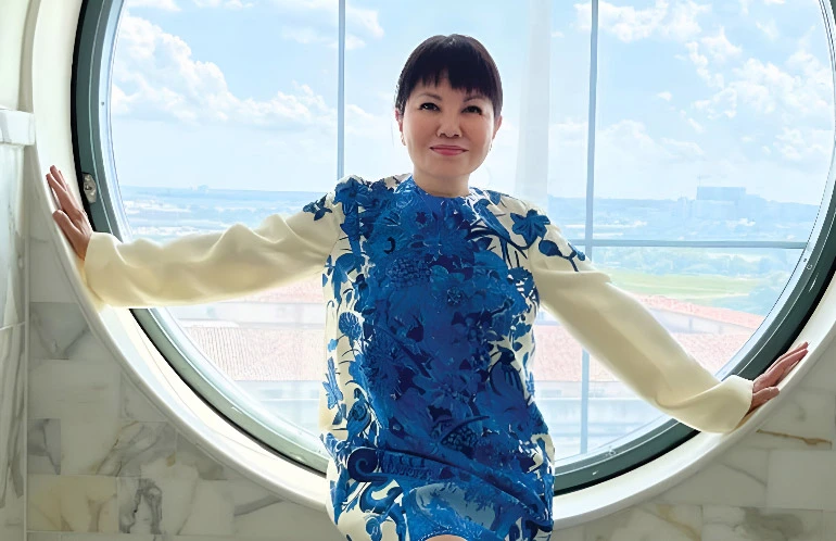 Woman smiling after blepharoplasty surgery