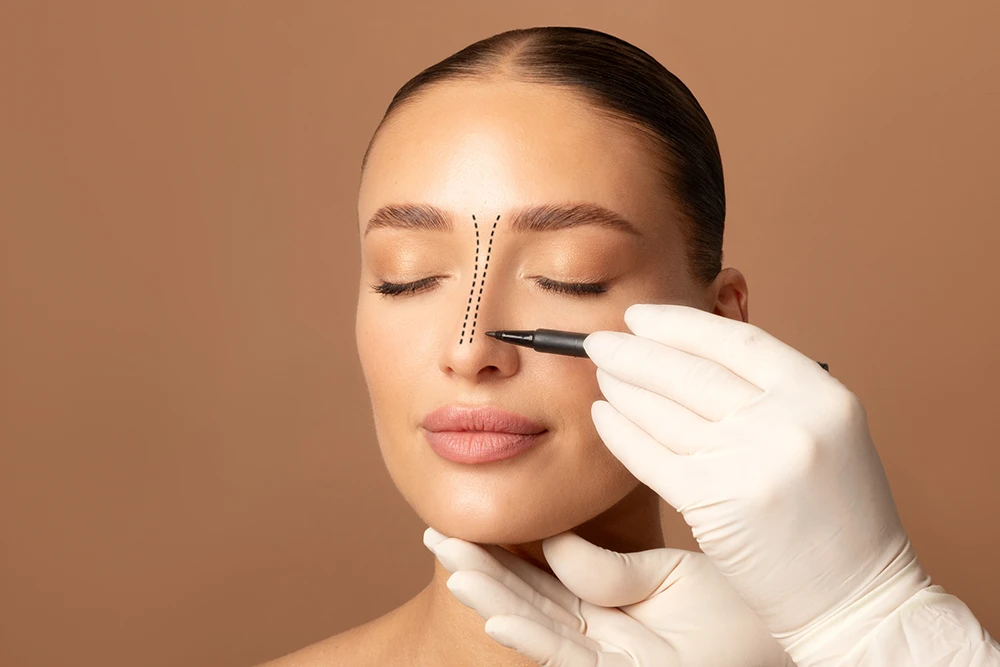 Facial Plastic Surgeon Marking The Nose Before Rhinoplasty