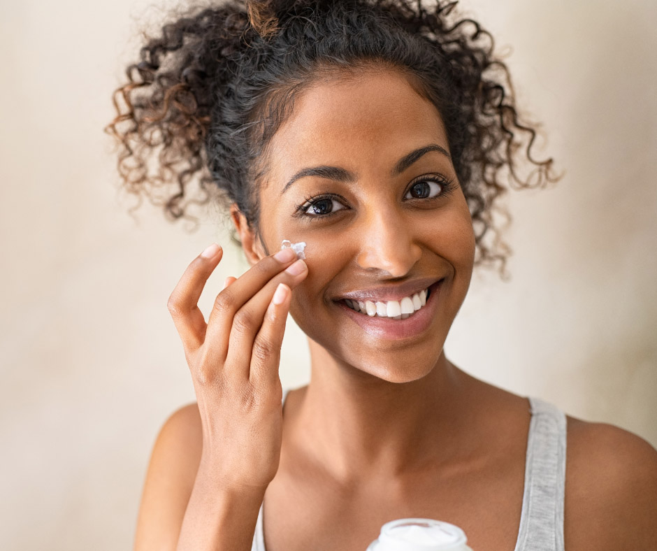 Female Applying Sunscreen As Part of Mini Facelift Recovery Guidelines