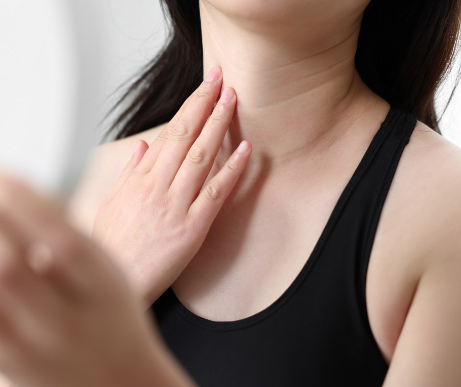 Woman Looking at Her Neck And Wondering If She Is a Candidate for Neck Lift